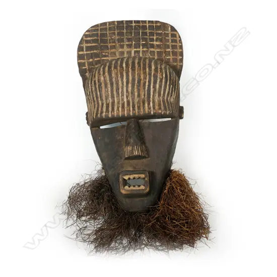 A carved wood African Songe mask,